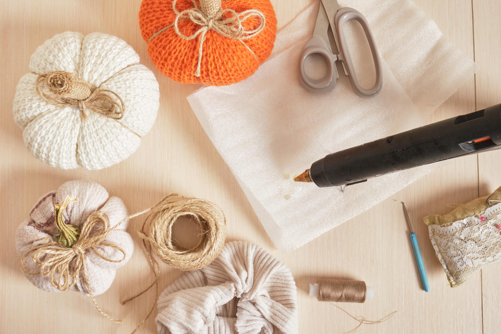 Workshop table with threads, hoops and sketches